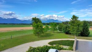 an aerial view of a park with mountains in the background at Bed & Breakfast Na Poljani in Kranj