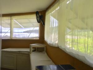 a small room with a window and a small table at The Hill B&B (El Morro Hosteria) in El Valle