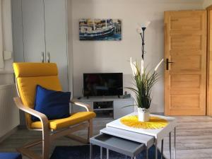 TV a/nebo společenská místnost v ubytování Dominik Apartmanház