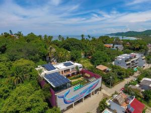 an aerial view of a house with a swimming pool at Casa de la Ballena in Sayulita