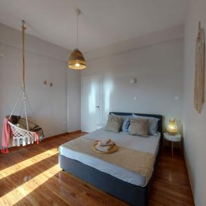 Ένα ή περισσότερα κρεβάτια σε δωμάτιο στο Onar Beachfront Residence, Loutraki