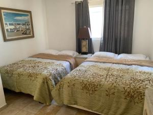 En eller flere senge i et værelse på San Carlos Sonora Casa Caracol Condominio