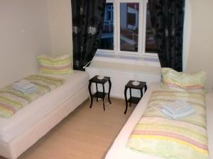 Ένα ή περισσότερα κρεβάτια σε δωμάτιο στο Guesthouse Tilraun