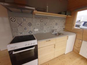 Eldhús eða eldhúskrókur á Waterhuisjes op de pier van LauwersmeerPlezier!