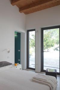 Postel nebo postele na pokoji v ubytování Agriturismo Casebianche