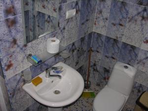 a bathroom with a sink and a toilet at Apartment Ureki in Ureki +32 photos