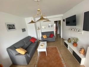 Televízia a/alebo spoločenská miestnosť v ubytovaní Apartamento céntrico con vistas y cerca de playa