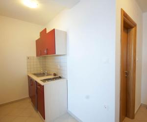 a small kitchen with a sink and a refrigerator at Mima in Sveti Juraj