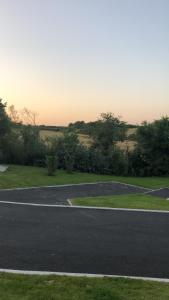 an empty parking lot next to a field at 1.2 padstow in Padstow