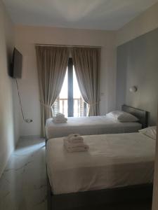 Voodi või voodid majutusasutuse Augusta Methoni Hotel toas