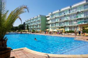 a large swimming pool in front of a hotel at Hotel Kotva - All Inclusive in Sunny Beach