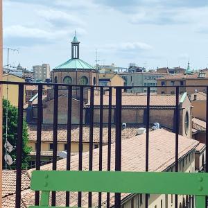 a green bench sitting on top of a building at Stayinbologna 3 in Bologna