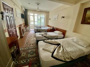 Postel nebo postele na pokoji v ubytování Kadikoy Kervansaray Hotel + 37 fotografií