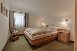 Letto o letti in una camera di Ferienwohnungen Johanneshof