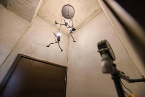 a camera and lights in a room with a door at 澎湖海景民宿 島嶼時光 Island Time Homestay in Magong