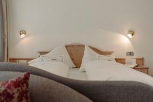Letto o letti in una camera di Ferienwohnungen Johanneshof