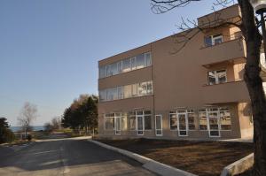 an empty street in front of a building at Casa Daniel Borbel in Saturn