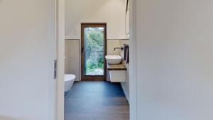 a bathroom with two sinks and a tub at Haus Kleemann K4 in Norderney