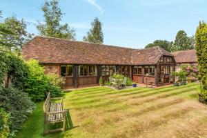 a house with a large yard in front of it at Carters Barn in Chipping Campden