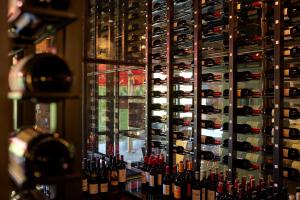a wall of wine bottles in a wine cellar at Le Grand Hôtel Le Touquet-Paris-Plage in Le Touquet-Paris-Plage