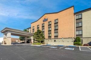an image of a hotel with a parking lot at Comfort Inn & Suites in Weatherford