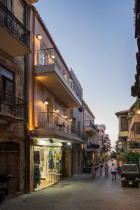 a group of people walking down a street at Veneri Boutique Suites in Chania