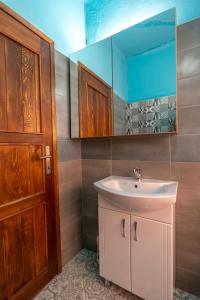 a bathroom with a sink and a mirror at Theatre Old Town House in Bitola