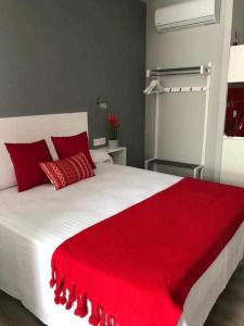 Posteľ alebo postele v izbe v ubytovaní Apartamentos Harmonia