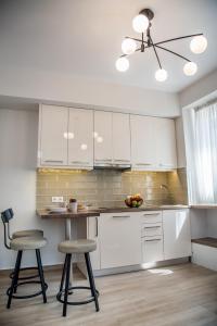A kitchen or kitchenette at Chrysanthi's Apartment
