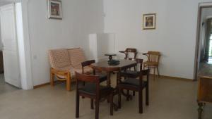 a dining room with a table and chairs at Da Francesca in Fiera di Primiero +15 photos