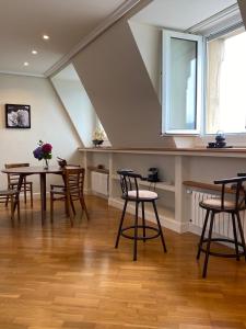 a dining room with a table and chairs at Olatu Haundia Donostian in San Sebastián