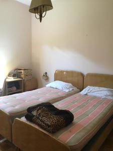Säng eller sängar i ett rum på Appartamento Giacomo Leopardi