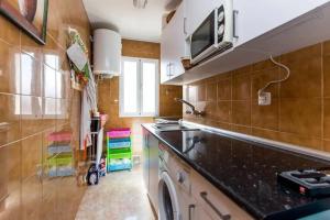 a kitchen with a sink and a counter top at HomeStay Olivos in Madrid