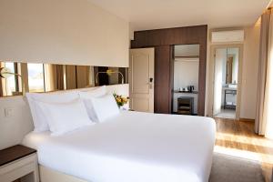Кровать или кровати в номере Hotel Cristal Setúbal