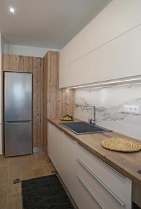 Kuchyň nebo kuchyňský kout v ubytování S & D Apartment