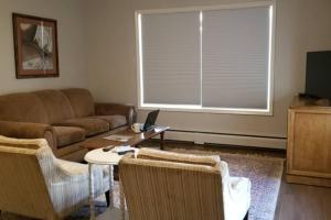 a living room with a couch and a window at Charming Home In Quiet Grangeville Neighborhood in Grangeville +24 photos