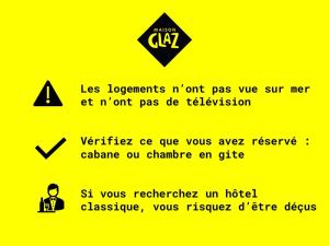 a sign on a yellow background with a sign with at Maison Glaz in Gâvres
