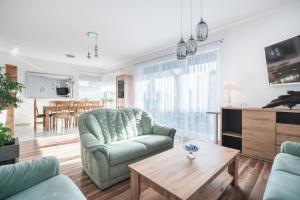 a living room with a couch and a table at JULIA in Reda