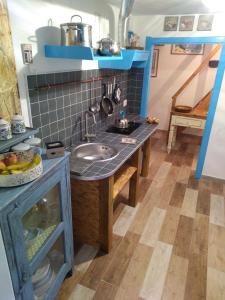 Kjøkken eller kjøkkenkrok på Piccola Casa Di Sardegna