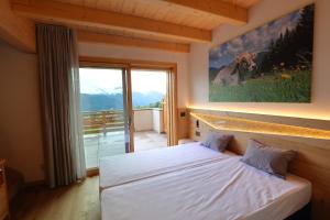 Postel nebo postele na pokoji v ubytování Agriturismo Maso Schneider