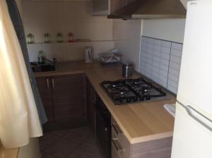 a kitchen with a stove and a counter top at Casa Vacanze Samira in Fondachello