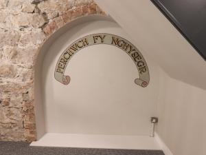 a sign that reads french ivy network on a wall at The Poppy Fields Abode in Rhyl