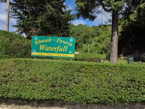 a sign for a wrigleydirect watchfield at The Poppy Fields Abode in Rhyl