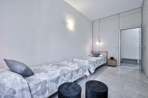 A bed or beds in a room at ACADAMIS - 4 min a piedi da Porta Susa