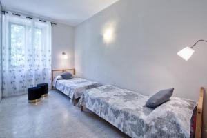A bed or beds in a room at ACADAMIS - 4 min a piedi da Porta Susa