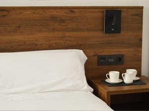 A bed or beds in a room at Encanto Tarazona