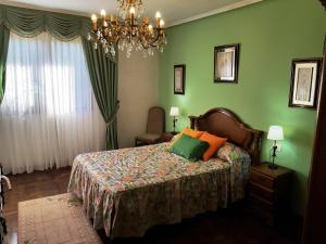 Llit o llits en una habitació de Fondu La Llosa - Casita cerca de Gijón