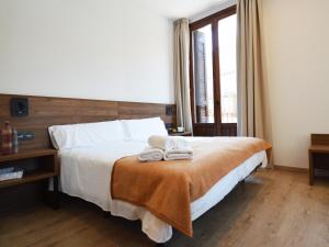 A bed or beds in a room at Encanto Tarazona