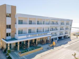 an overhead view of a hotel with tables and chairs at Tylos Beach Hotel in Kato Pyrgos