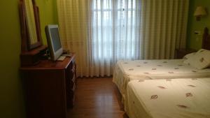 Postel nebo postele na pokoji v ubytování Tierra De Lobos